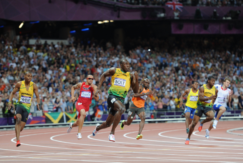 Illustration for article titled Photos Of Usain Bolt Looking Bored As He Blows Past The Best Runners In The World